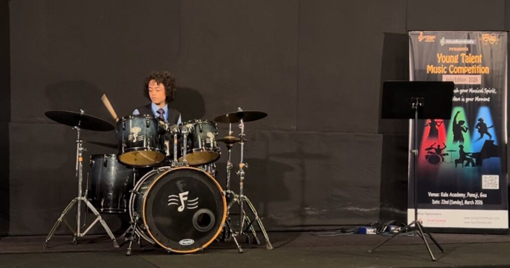Aurum playing the drum kit on stage