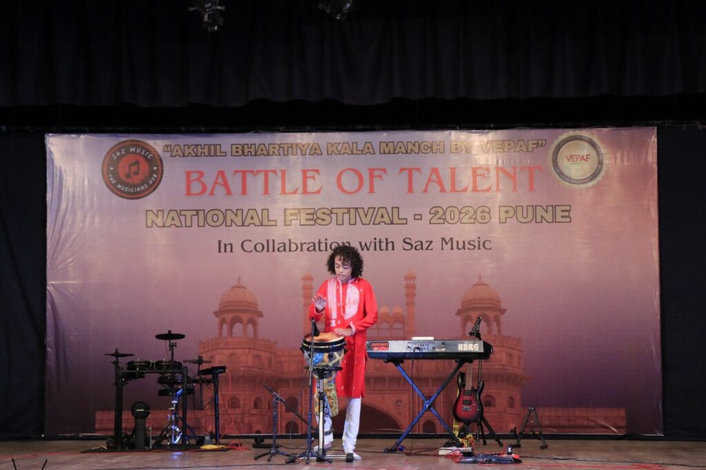 Wide view of Aurum performing on a large stage